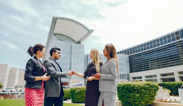 Business handshake between UAE consultants and clients in Dubai